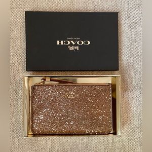 Coach starts glitter wristlet